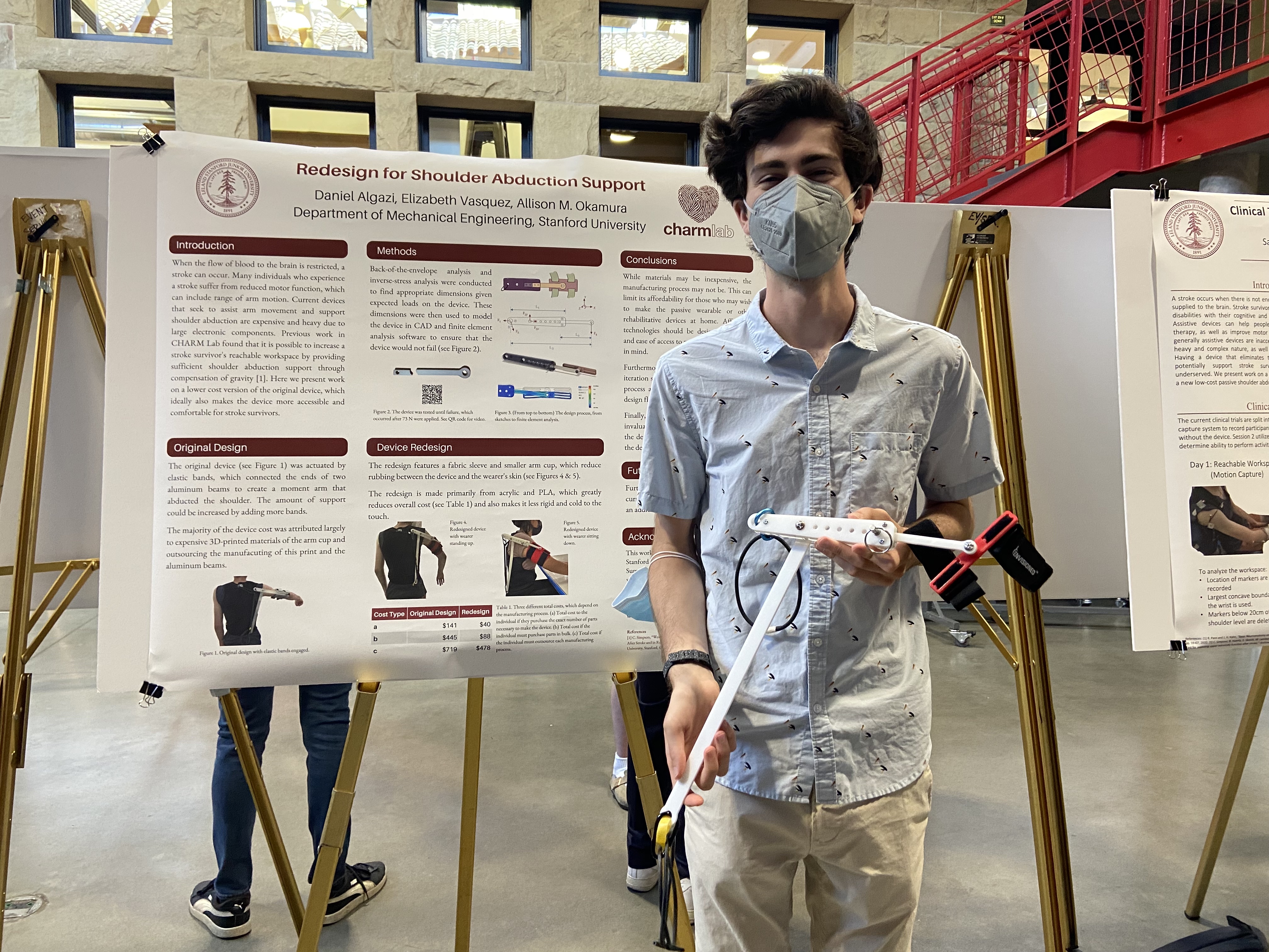 dani in front of his poster entitled: redesign for shoulder abduction support